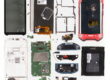 Gigapixel teardown image of a Zebra TC67HO enterprise handheld computer, showing the logic board, battery, barcode scanner module and flex cable assemblies