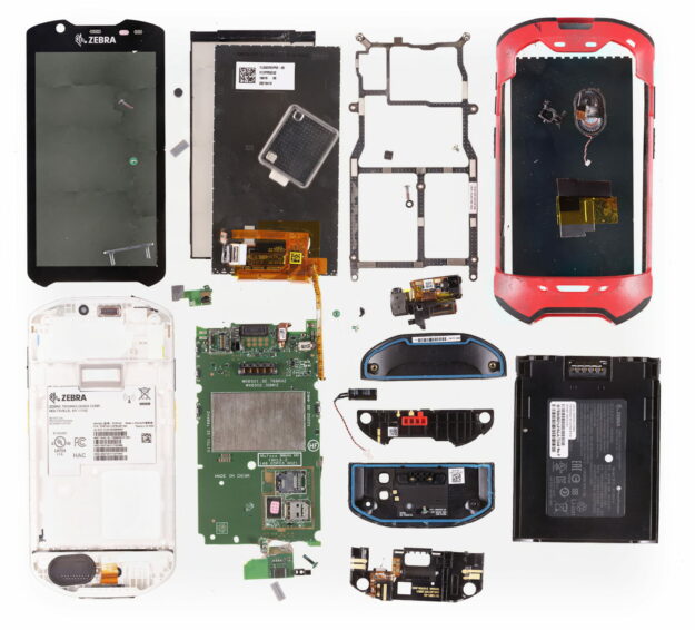 Gigapixel teardown image of a Zebra TC67HO enterprise handheld computer, showing the logic board, battery, barcode scanner module and flex cable assemblies