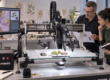 Scientists discuss an image capture brief in the lab