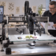 Scientists discuss an image capture brief in the lab