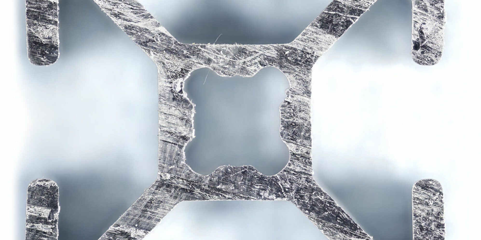Gigapixel image of an aluminum 8020 2020 extrusion cross-section showing T-slot geometry for blog post " Set the Resolution"